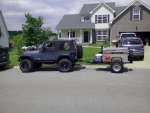 trailer and Jeep in front of house.jpg