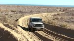 stock-footage-uzbekistan-circa-an-old-jeep-passes-on-a-deeply-rutted-road-near-the-aral-sea-uzbe.jpg