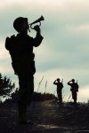wwii-soldier-playing-taps.jpg