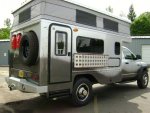 2009 Silver Dodge Sterling Uhaul Custom Camper Bullet XV - ext rht rear angle.jpg