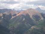 Distant Wetterhorn,Coxcomb,Matterhorn, and Uncompahgre Peaks behind Red Mountain from near Lake .JPG