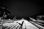 silhouette of photographer with tripod under starry sky in the borderlands of West Texas