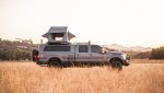 Ford Powerstroke Overland rooftop tent at sunset in field SomedayAdventure.jpg Ford Powerstroke Overland rooftop tent at sunset in field SomedayAdventure.jpg