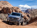 Ford F250 Tremor with Norweld Deluxe Weekender Tray on Sandy Road Below La Sal Mountains.jpg