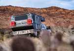 Ford F250 and Four Wheel Campers Hawk UTE Seen from Behind Below Sandstone Cliffs.jpg