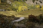 Mountain Road Winding Through Autumn Landscape.jpg