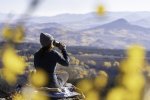 Woman Sipping Coffee Seated on Voited Blanket and Enjoying View of Fall Colors Near Steamboat ...jpg