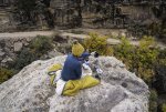 Woman Making Kuju Coffee on Boulder Above Canyon at Guacamole Mesa.jpg