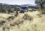 Melissa Edge Greets Morning Light Wearing a Voited Blanket at an Overlanding Campsite near Sed...jpg