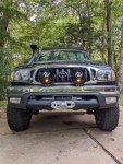first-gen-tacoma-stock-bumper-off-road-lights-installed.jpg