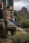 Pug Kissing Woman Sitting on Torklift Stairs on Overland Camper.jpg