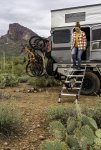 Woman and Pug Dog Walking Down Torklift Stairs While Exiting Overland Camper.jpg