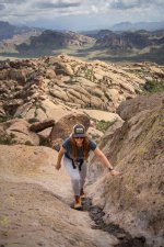 Hiker Ascending Steep Rock Chute on Cave Trail II.jpg
