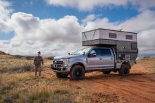 Man Walking Past Overland Camper at Campsite near Sedona.jpg